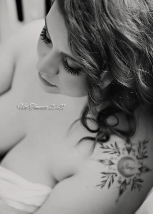 Black and white close up boudoir portrait of woman, taken from above. 